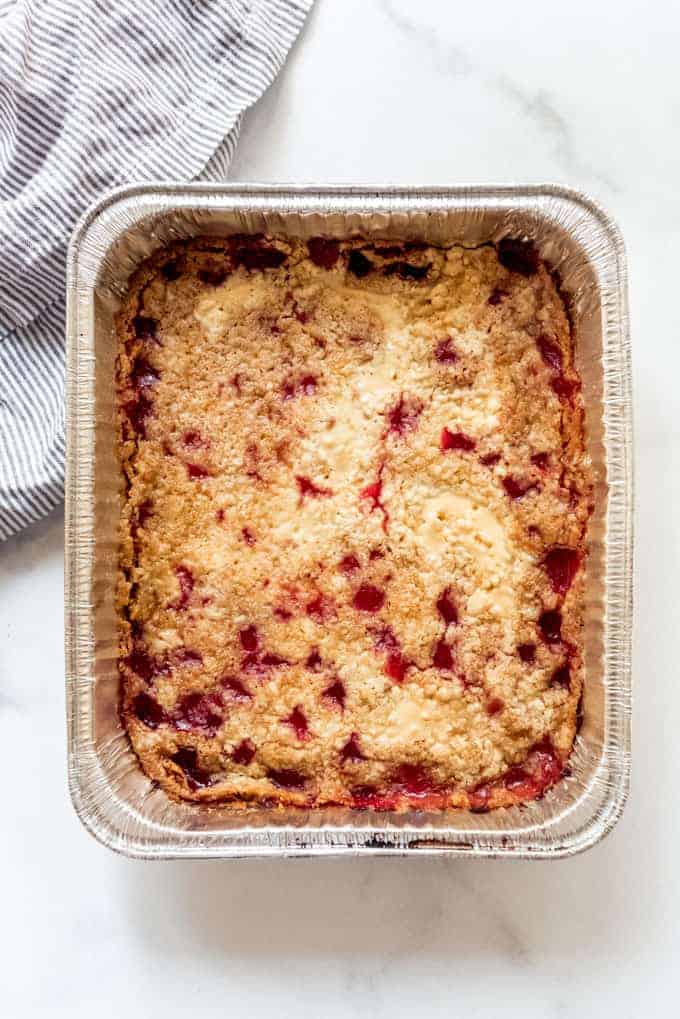 Smoked cherry dump cake in a disposable pan