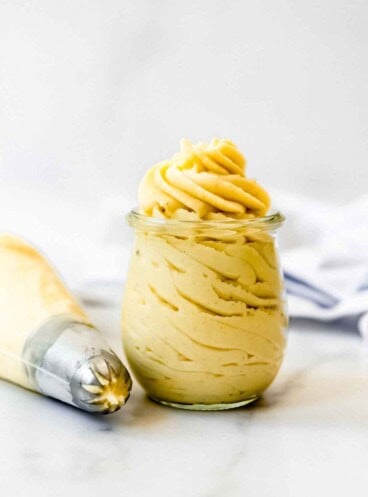 A glass jar filled with French pastry cream.