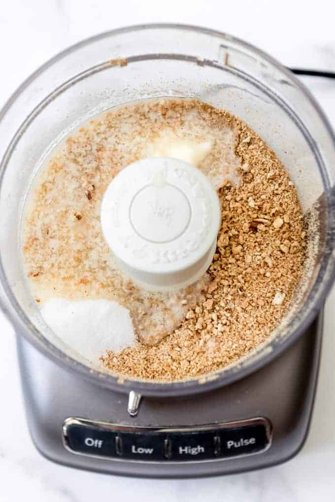 sugar added to the graham cracker and pecan crust mixture in a food processor
