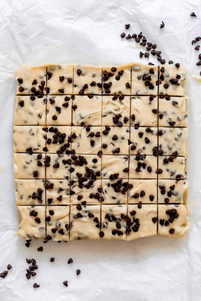 Cookie dough fudge topped with chocolate chips then sliced into small squares.