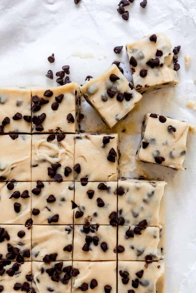 Squares of chocolate chip cookie dough fudge that have just been sliced.