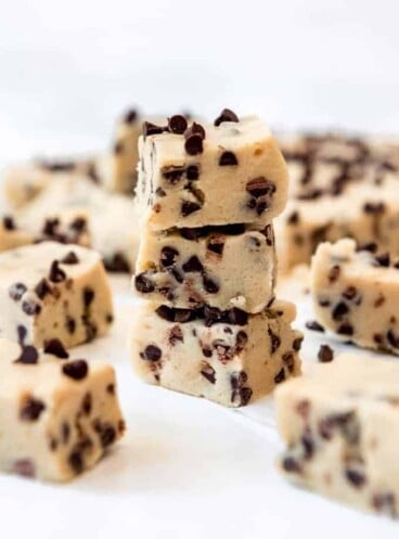 A stack of pieces of homemade cookie dough fudge.