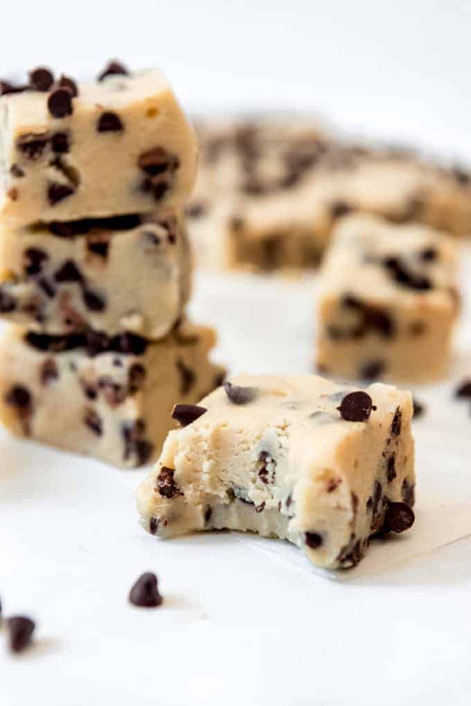 A piece of cookie dough fudge with a bite taken out of it.