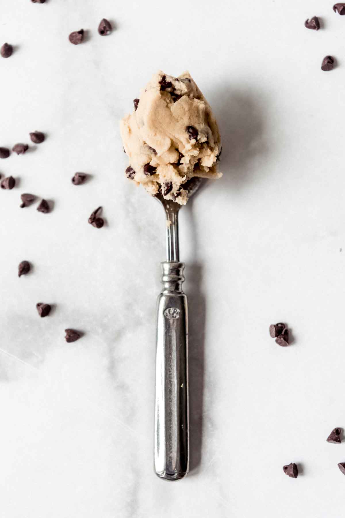 A spoonful of eggless chocolate chip cookie dough.