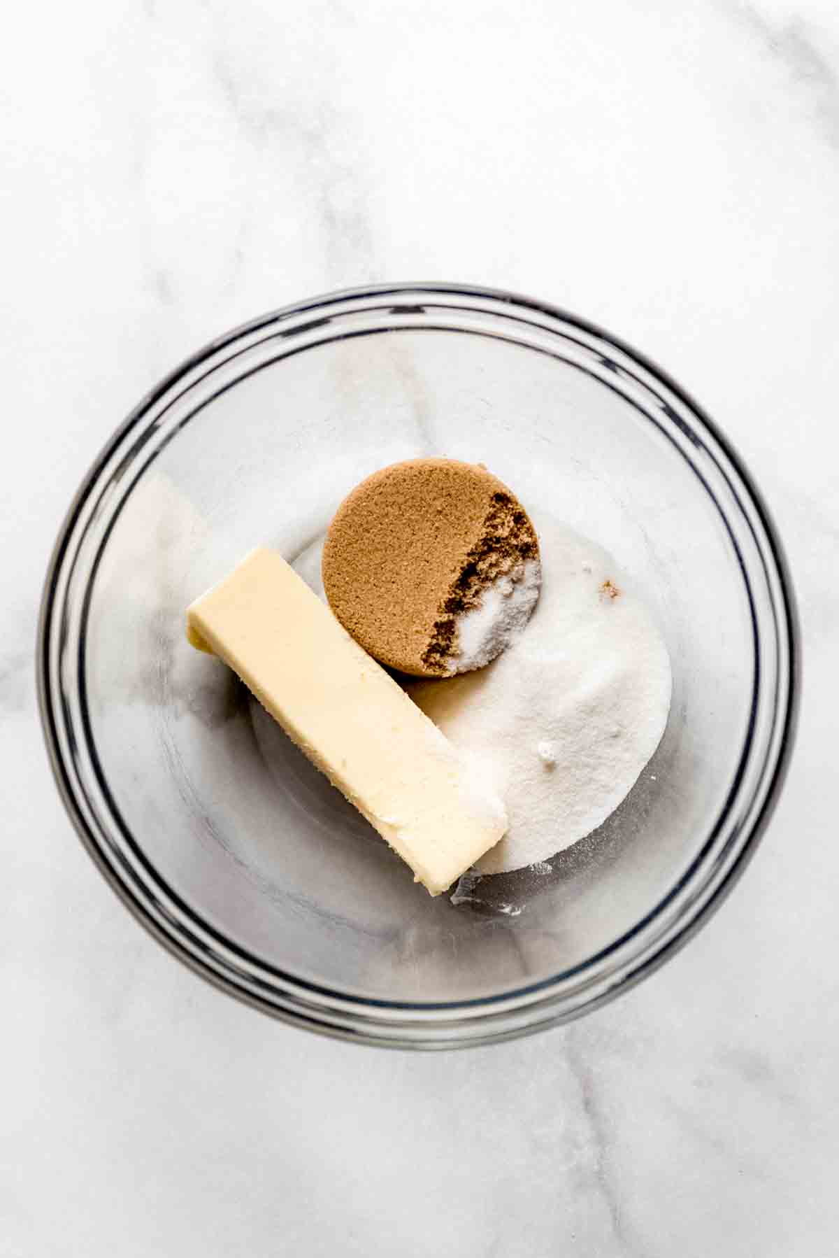 A bowl with sugars and butter inside.