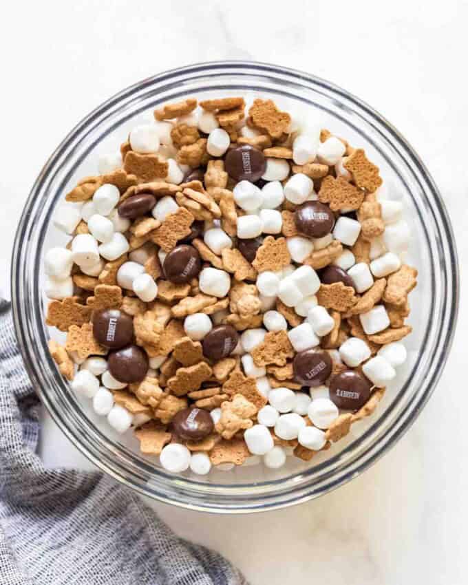 A large bowl filled with Teddy Grahams, marshmallows, and Hershey's chocolate drops.