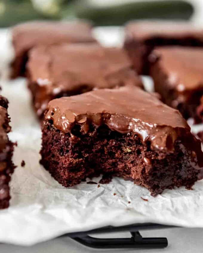 A zucchini brownie with a bite taken out of it.