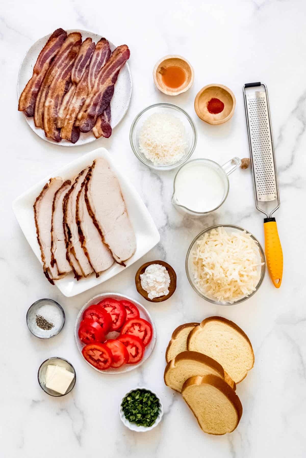 Overhead view of ingredients for Kentucky hot brown sandwiches.