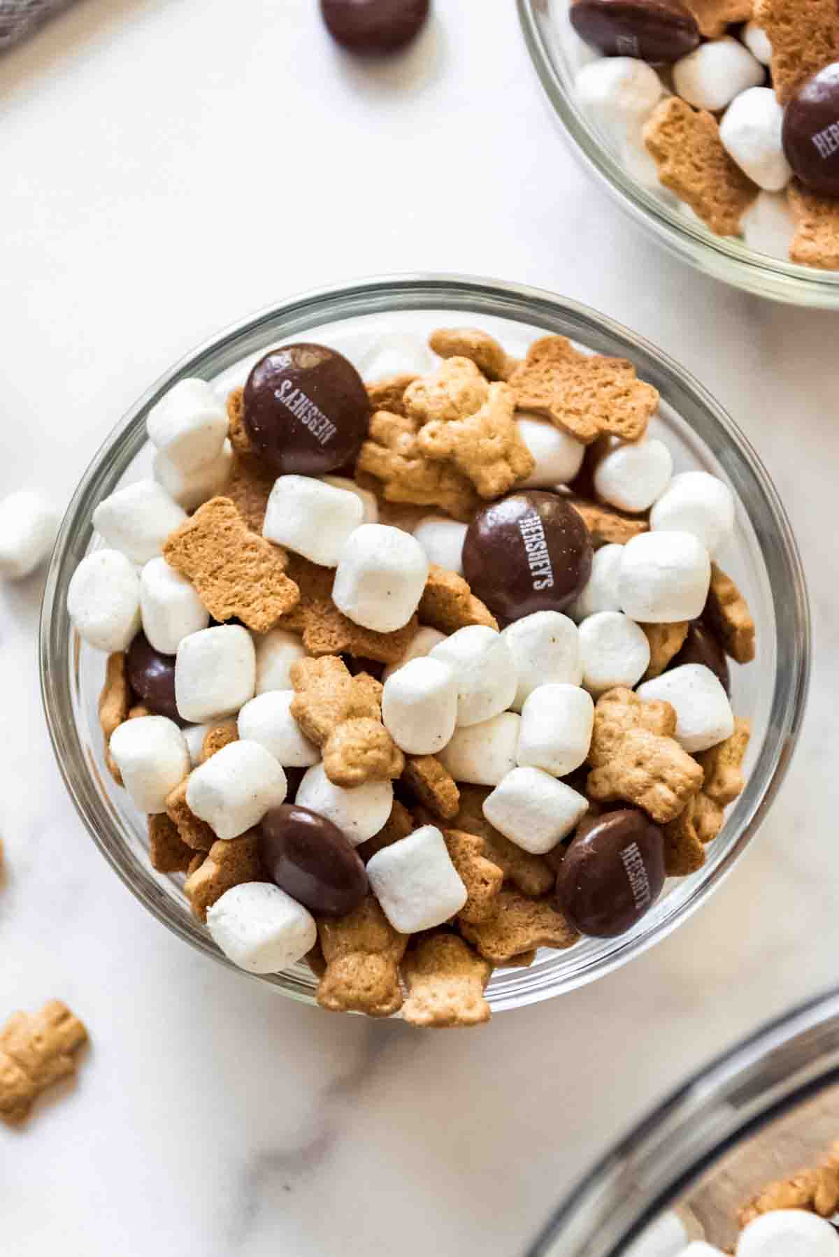 A close up image of a bowl of s'mores snack mix.