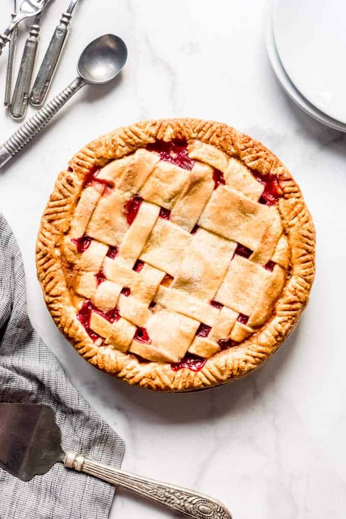 Baked raspberry peach pie with lattice style top crust
