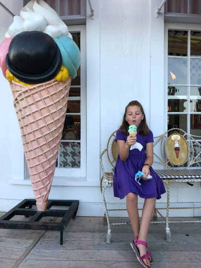 A child eating an ice cream cone.