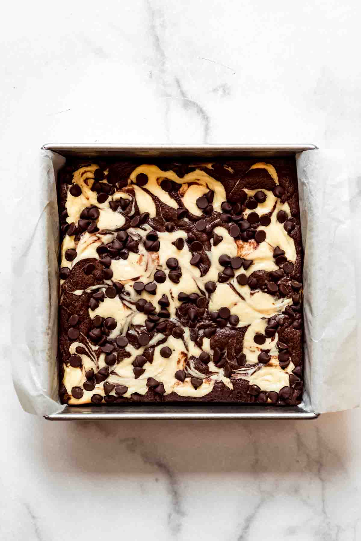 Baked cream cheese brownies with chocolate chips.