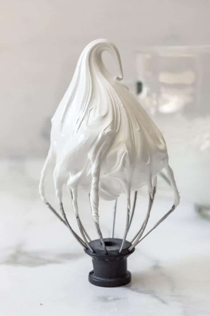 Homemade marshmallow fluff on a wire whisk Kitchenaid attachment.