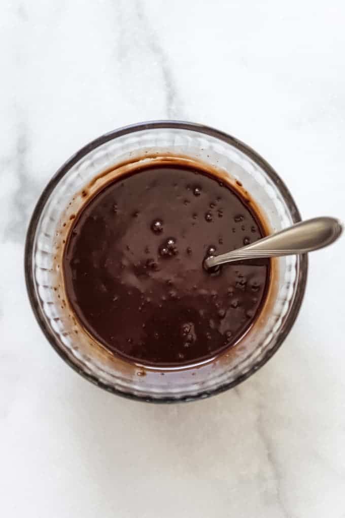 A bowl of melted chocolate ganache