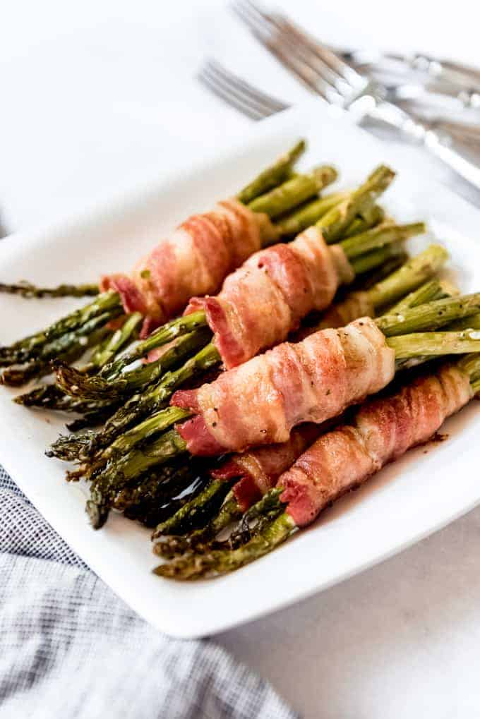 Bacon Wrapped Asparagus on white plate