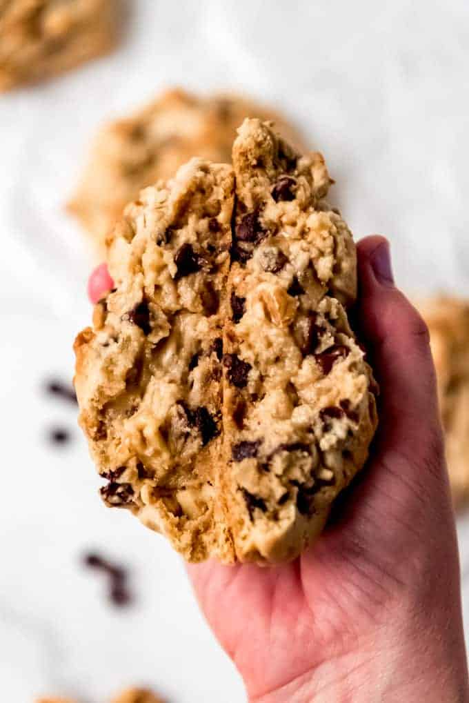 hand holding thick Levain Chocolate Chip Cookies