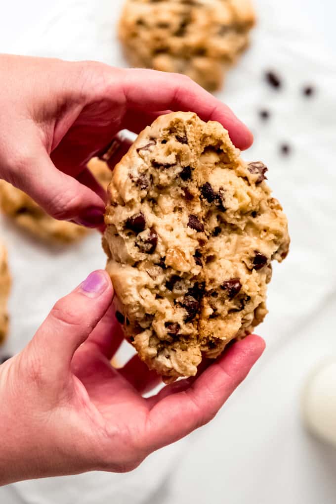 Hands holding Levain Chocolate Chip Cookies