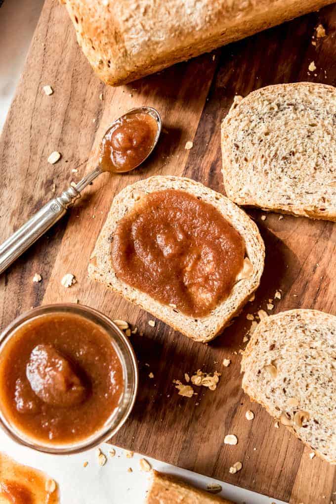 A slice of multigrain bread spread with homemade apple butter.