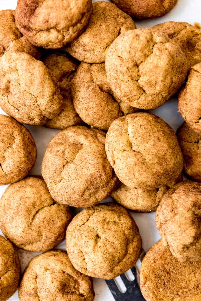 A close image of pumpkin snickerdoodles piled on top of each other.