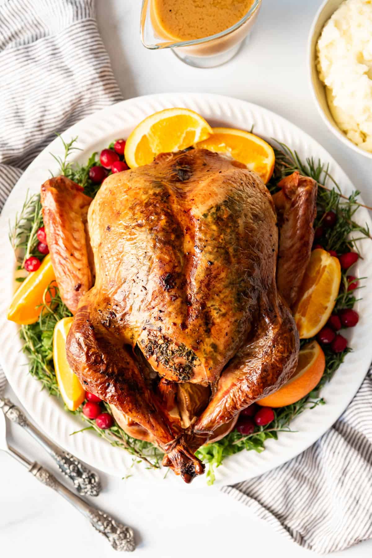 A whole herb roasted turkey with crispy skin.