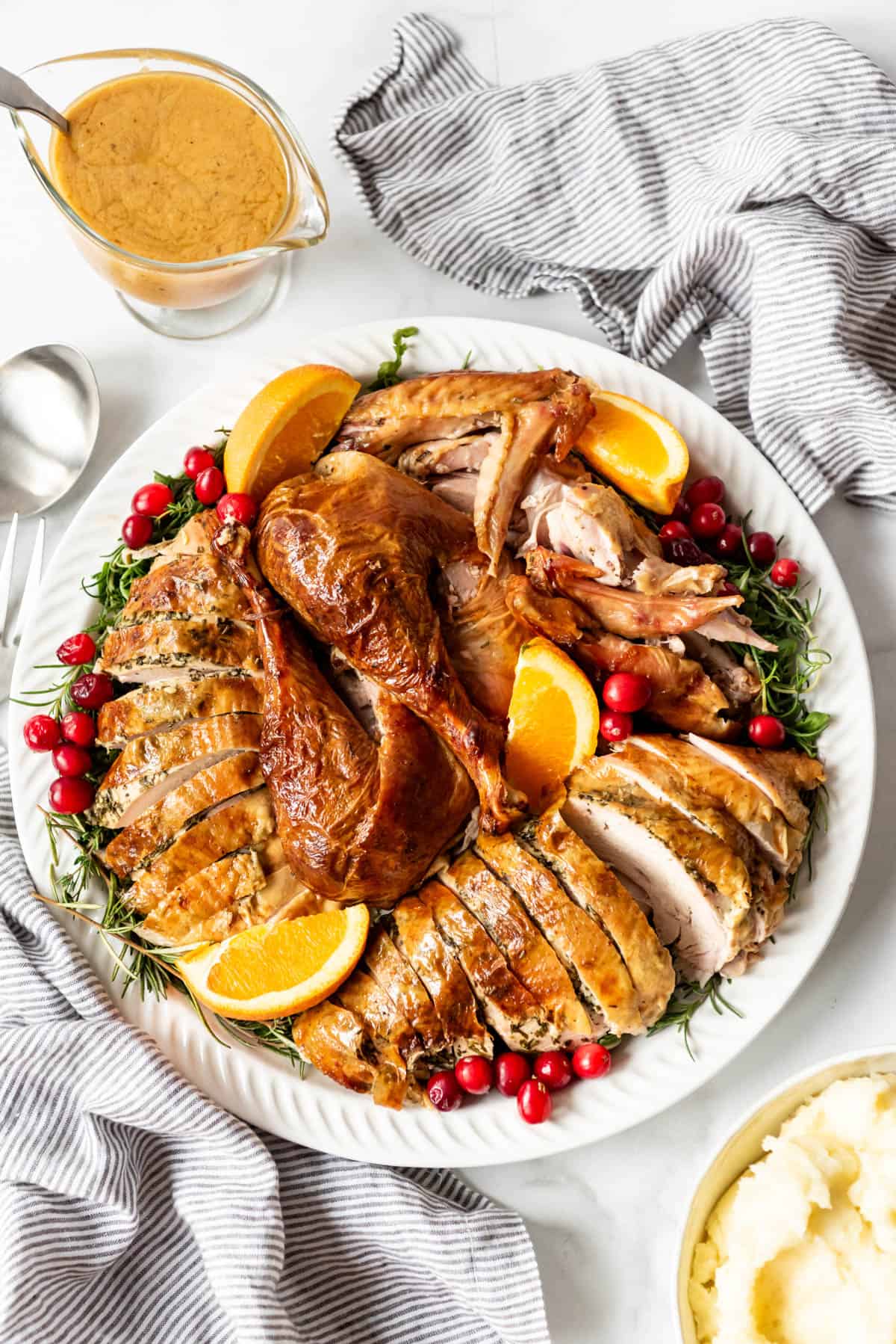 Carved turkey on a round platter.