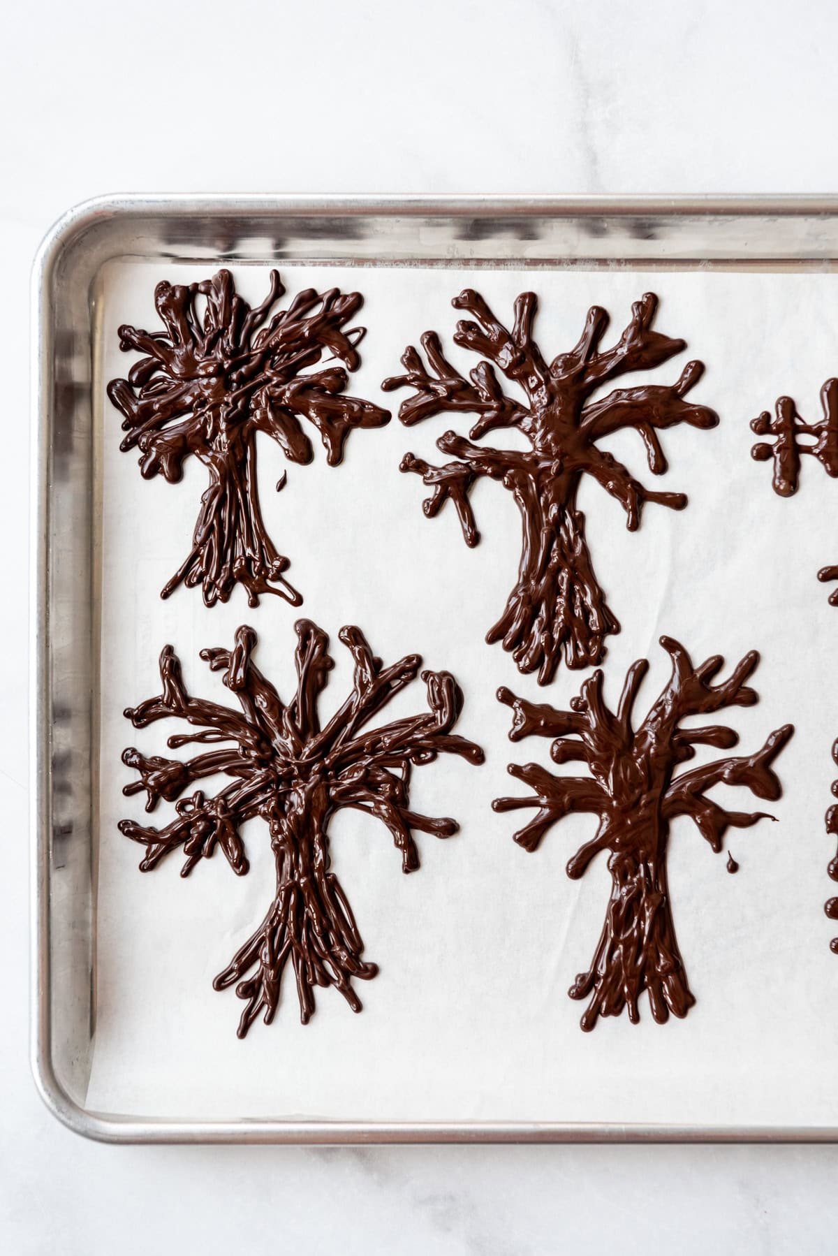 Chocolate trees on parchment paper.