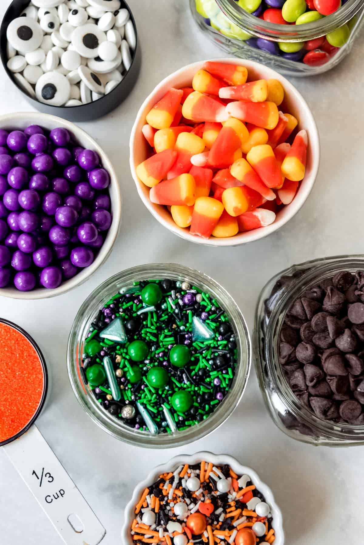 Halloween candies in individual bowls.