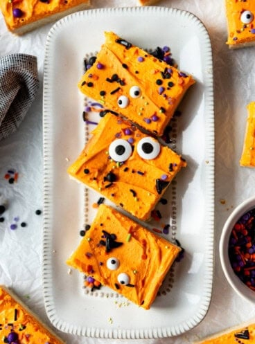 Three sugar cookie bars on a plate.