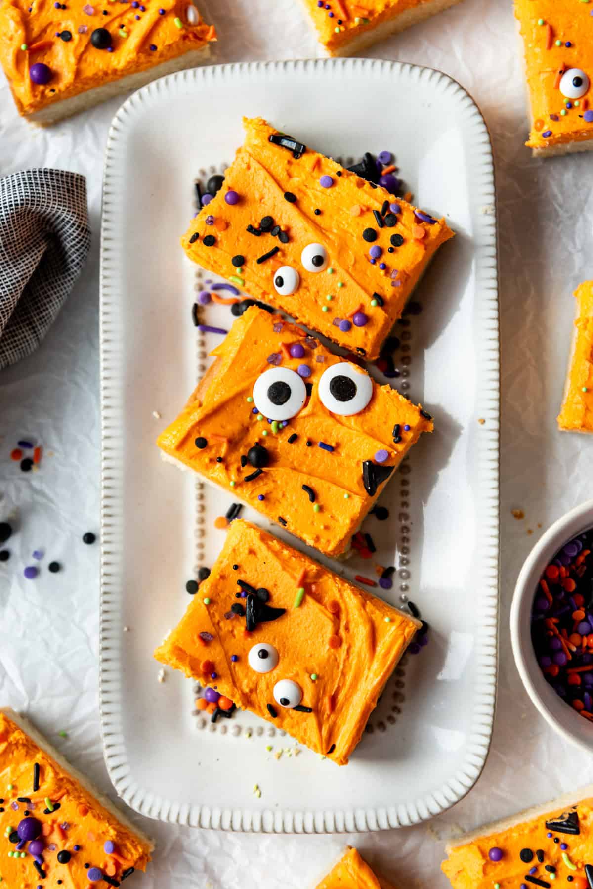 Three sugar cookie bars on a plate.