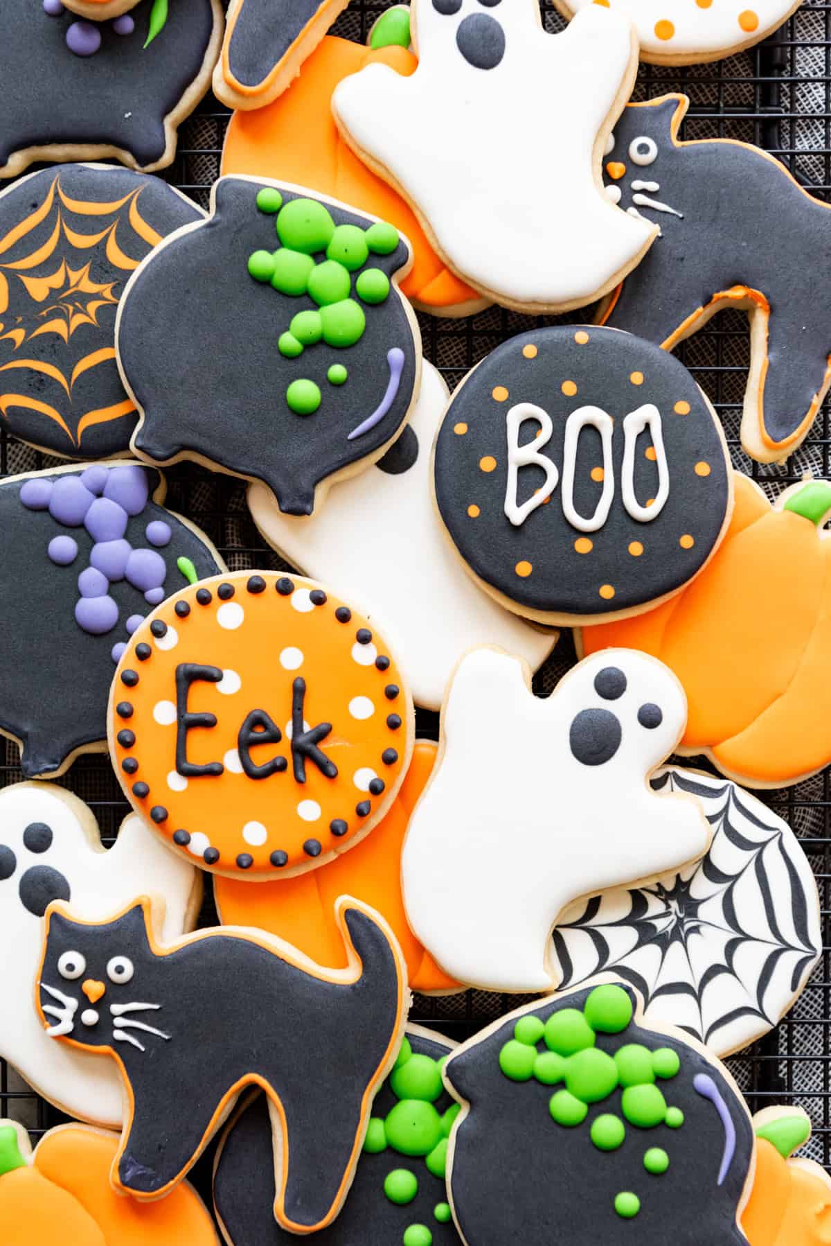 Cut-out sugar cookies decorated in Halloween designs.