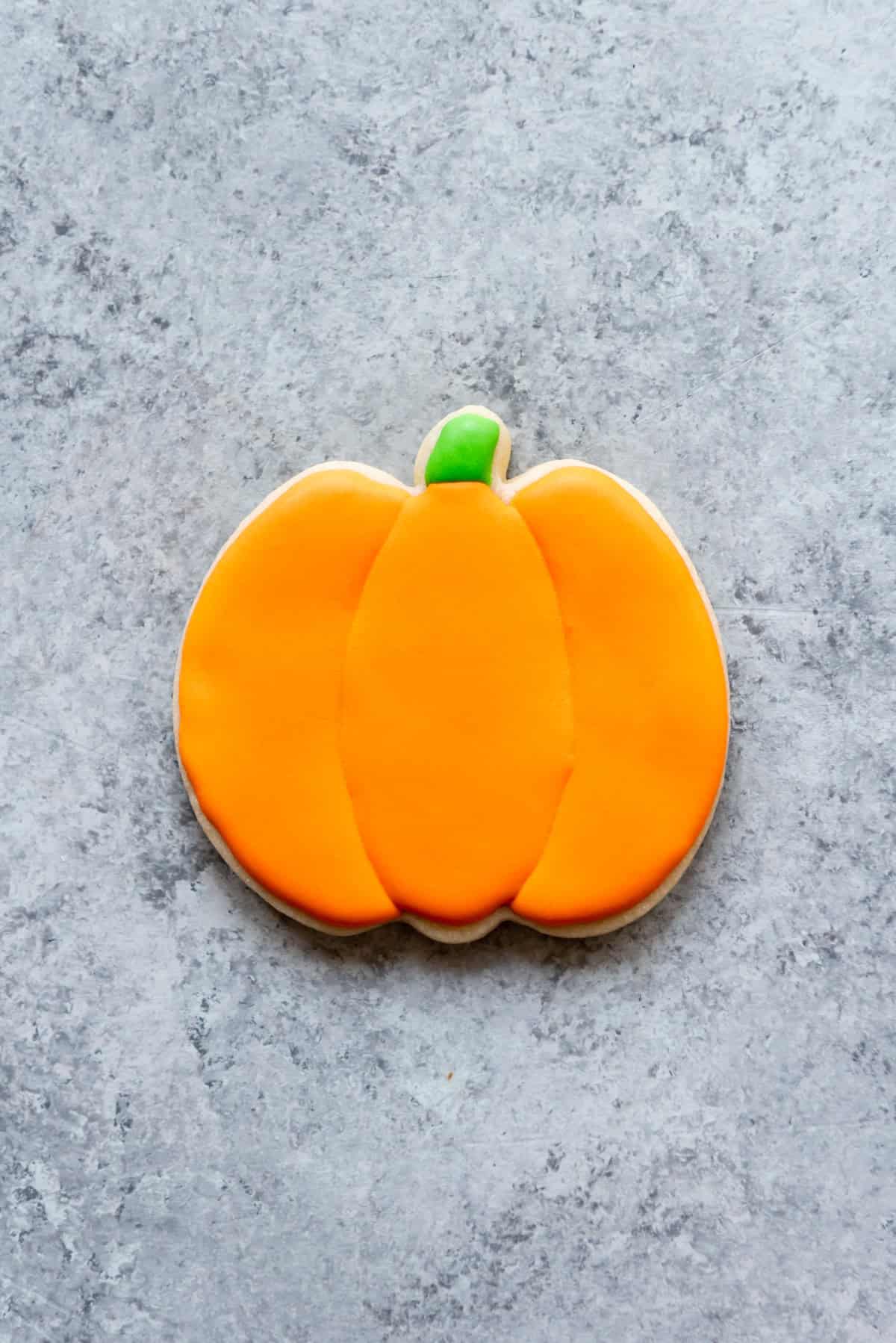 An image of a pumpkin sugar cookie.