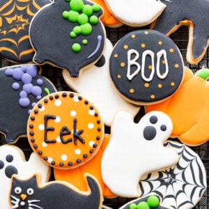 Cut-out sugar cookies decorated in Halloween designs.