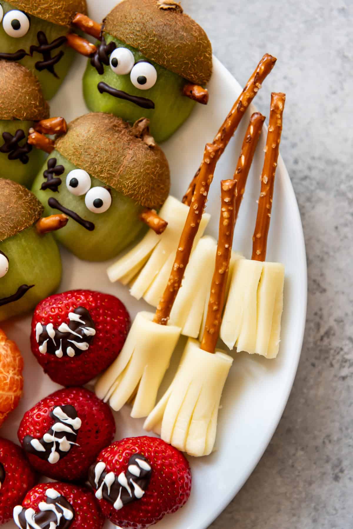 Witches broom snacks made from pretzels and string cheese.