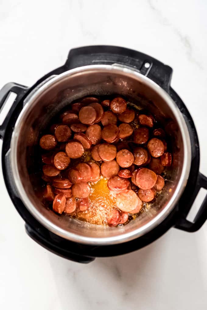 Andouille sausage being cooked in an instant pot.