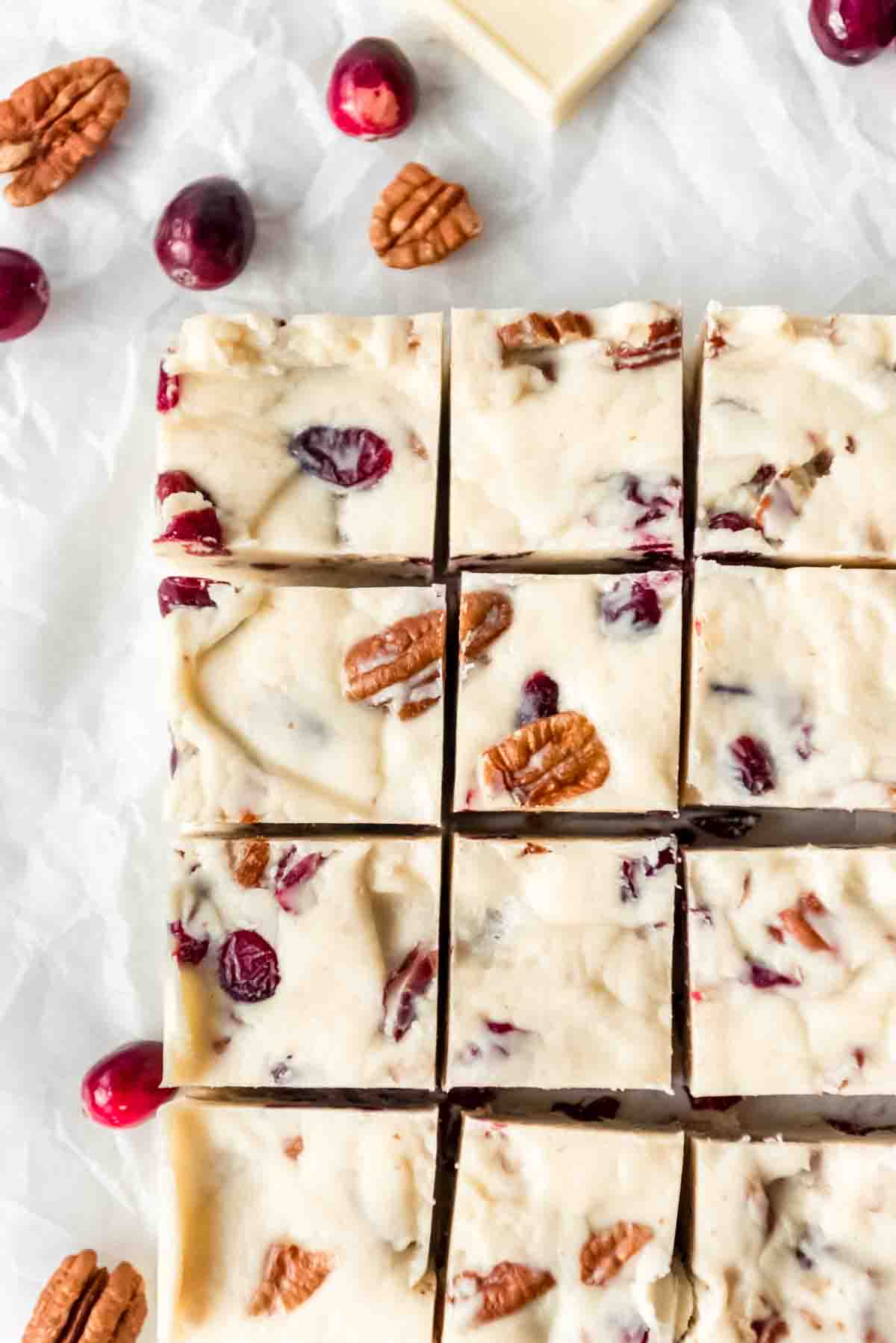 Squares of white chocolate cranberry pecan fudge.