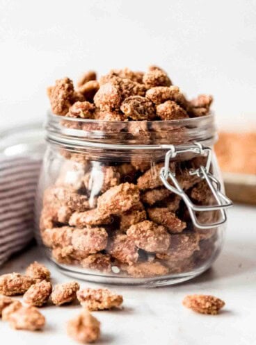 Sugared almonds in a glass jar.