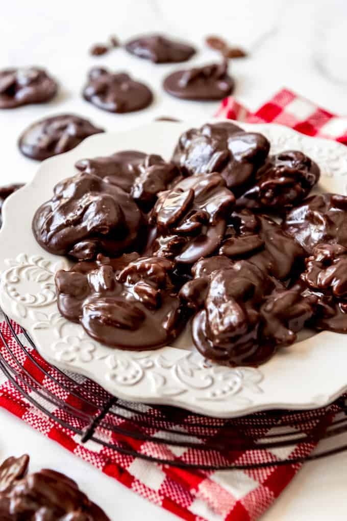 Chocolate pralines on a white plate.