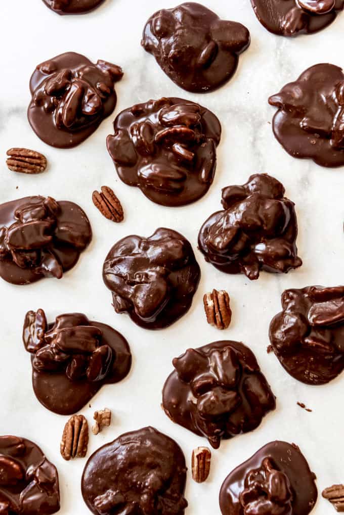 Chocolate pralines on a white surface.