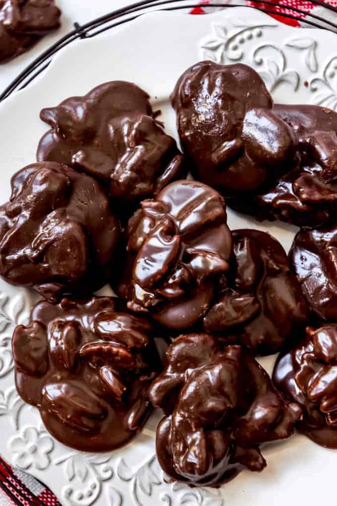 Chocolate praline candy on a white plate.