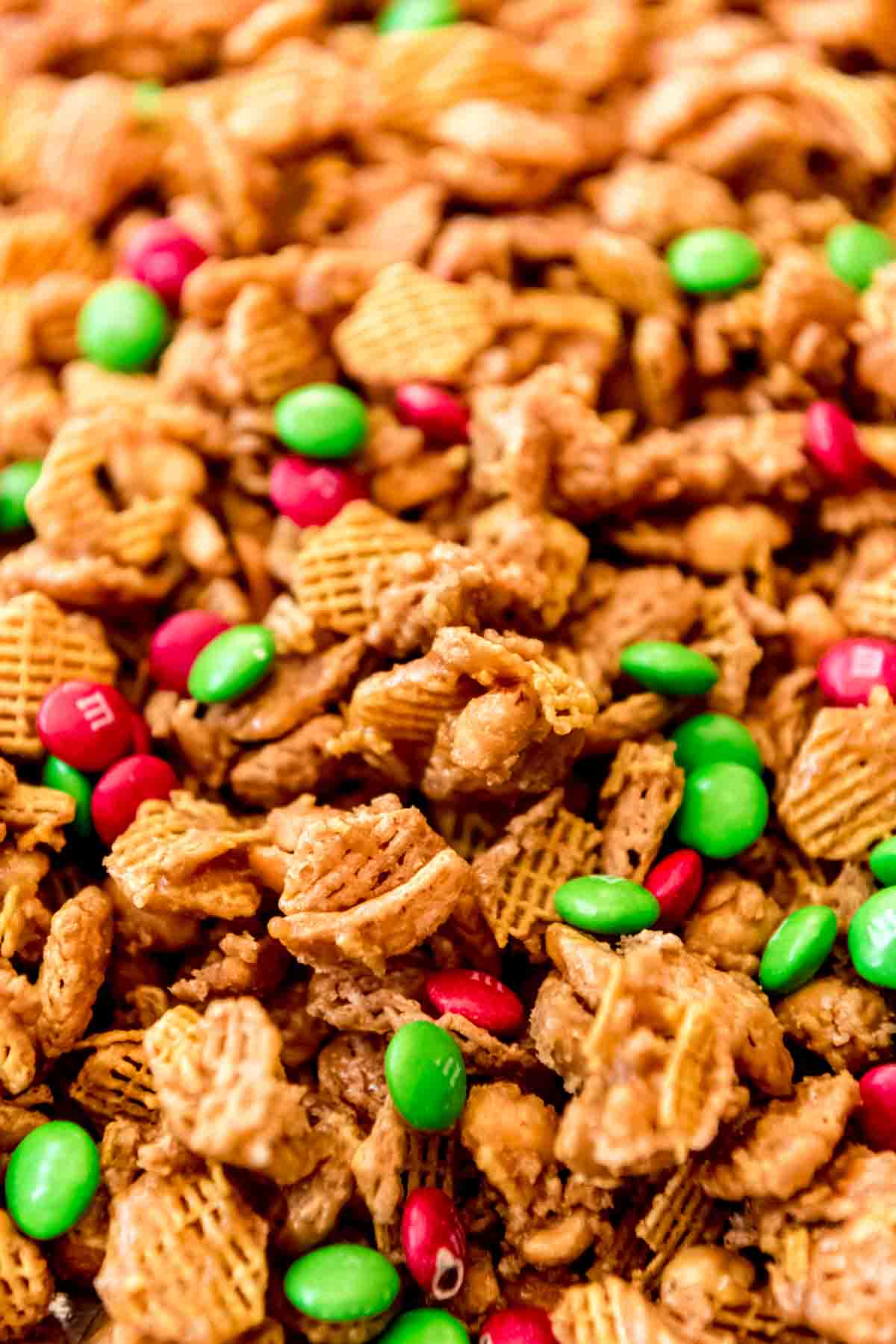 A close image of crispix mix with peanuts and chocolate candies