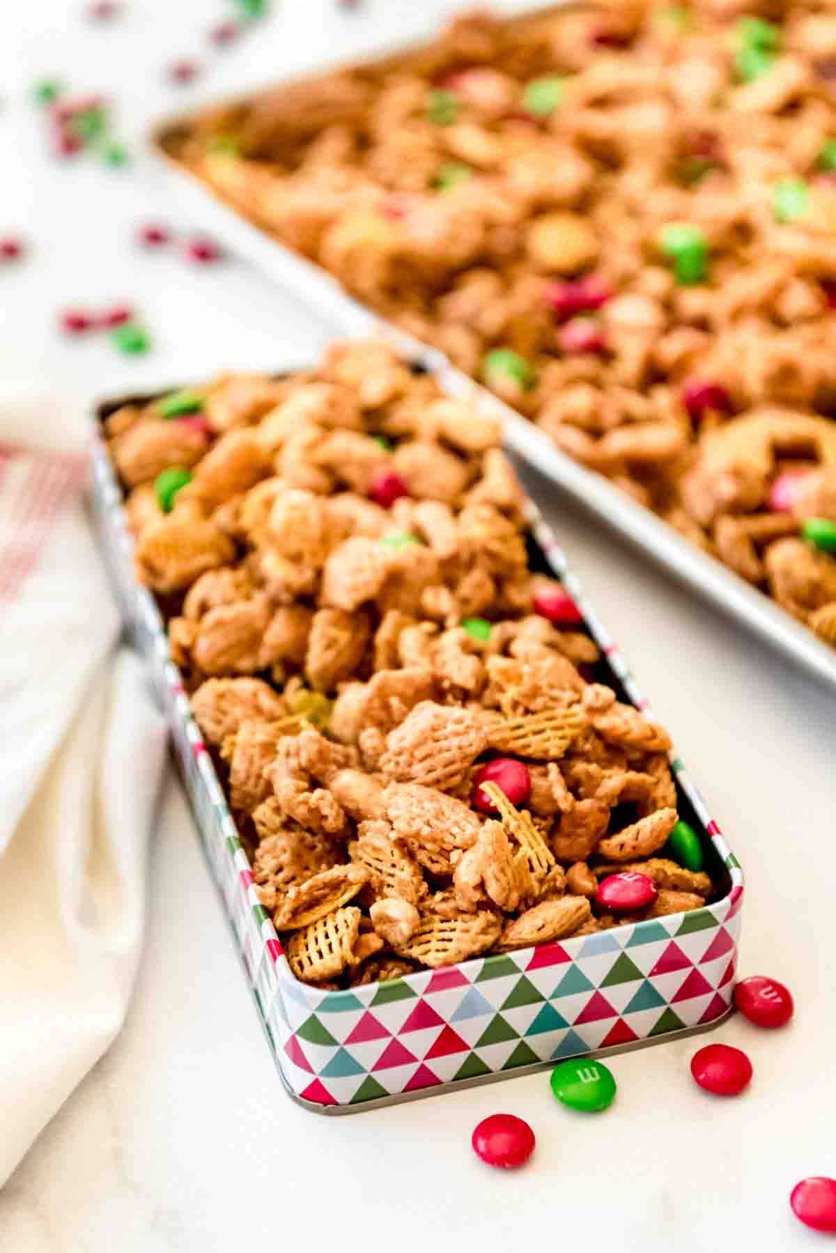 Caramel coated crispix mix in a decorative tin.