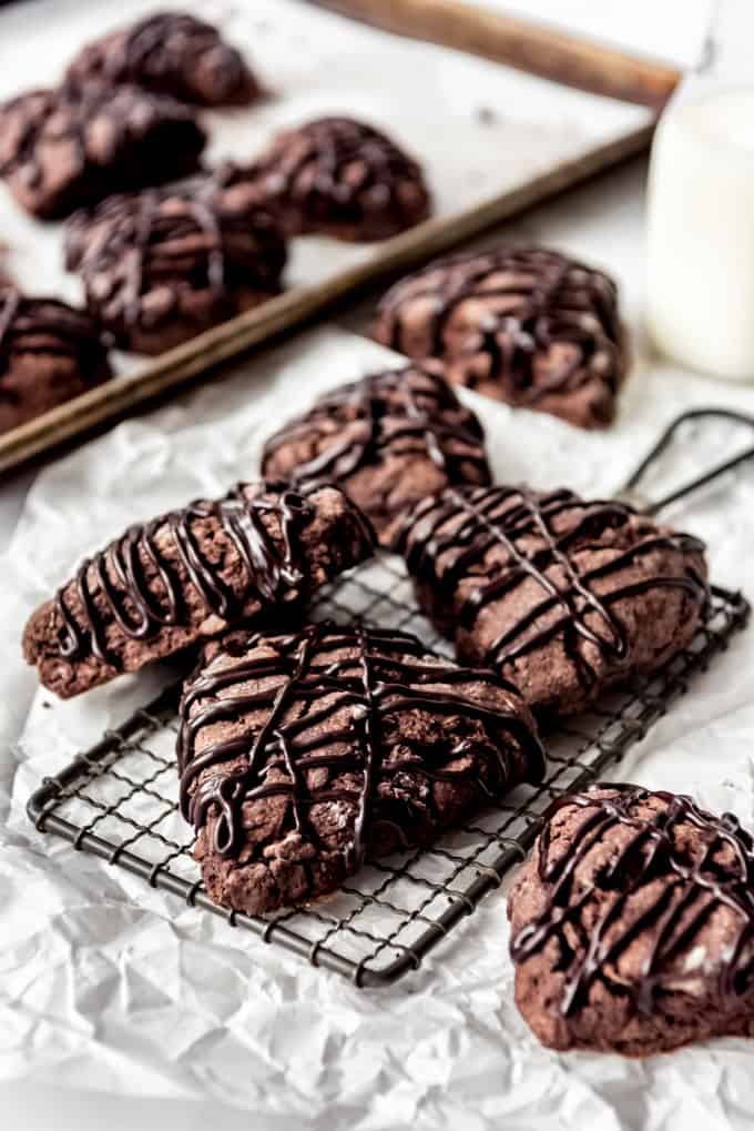 chocolate scones on a cooling rack and table