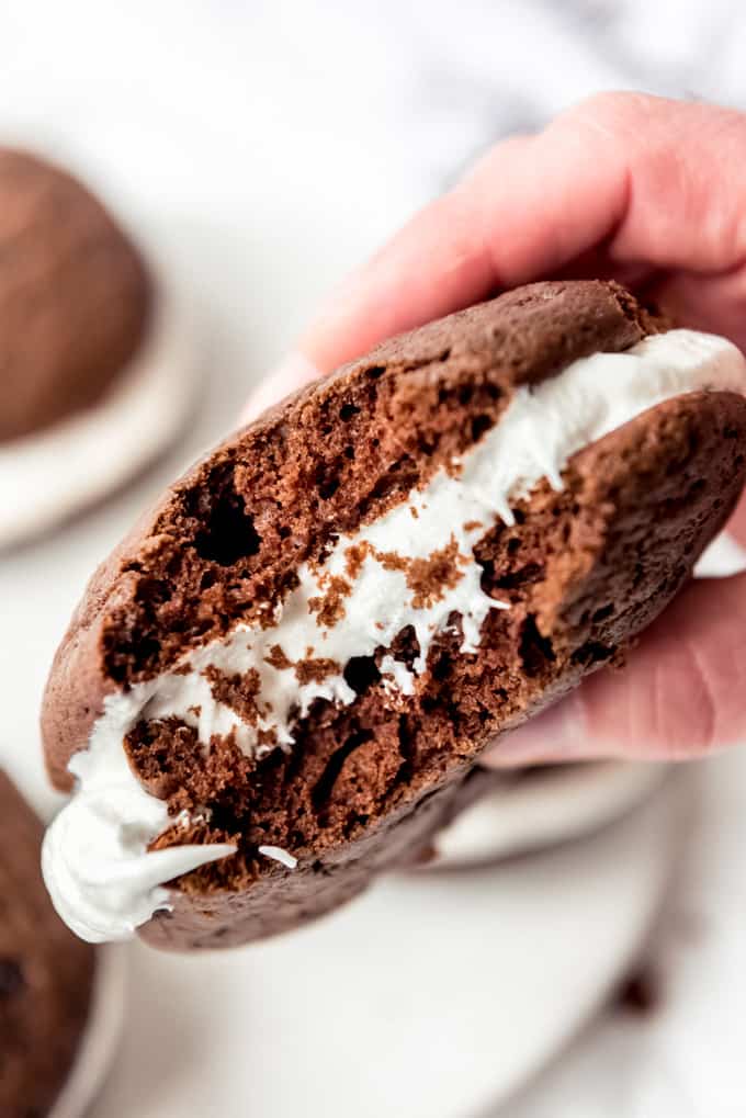 A whoopie pie with a bite taken out of it.