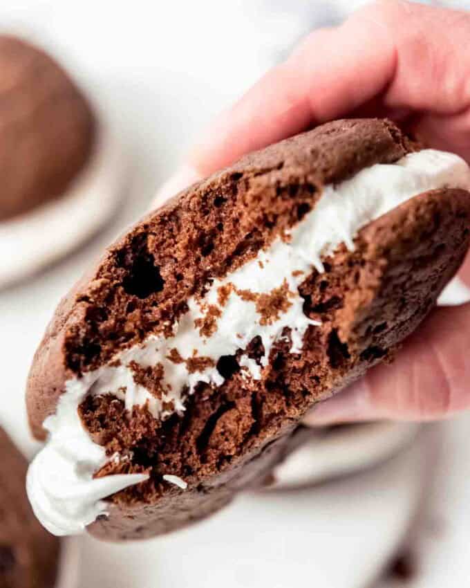 A whoopie pie with a bite taken out of it.