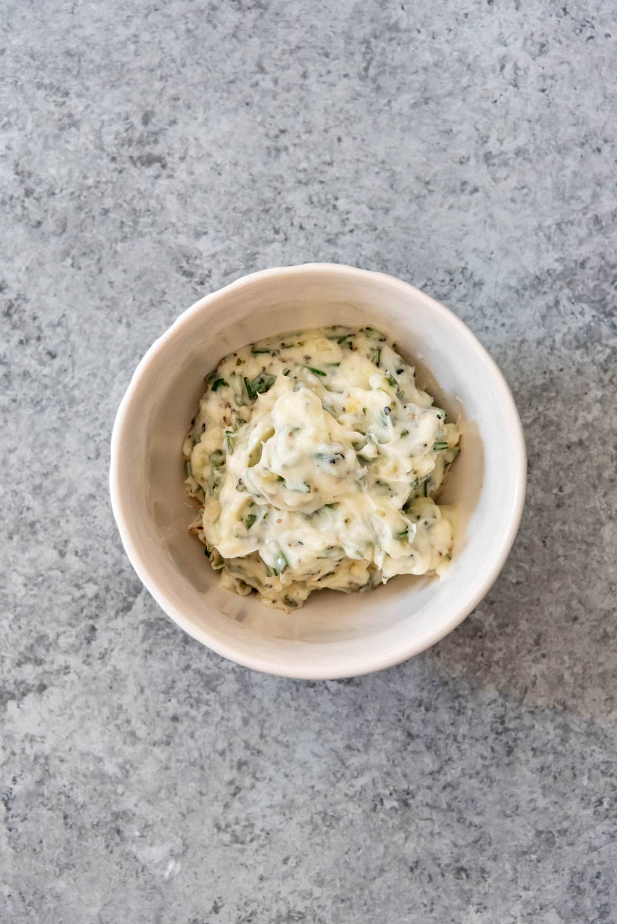 Garlic herb butter in bowl.