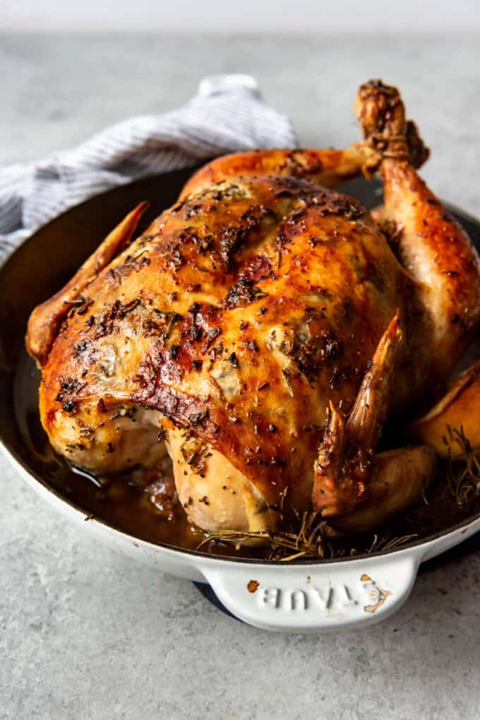 An image of a roast chicken in a pan.