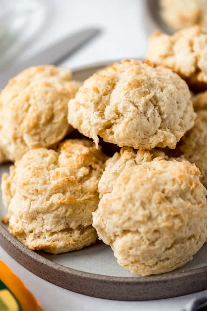Pile of drop biscuits on a grey plate.