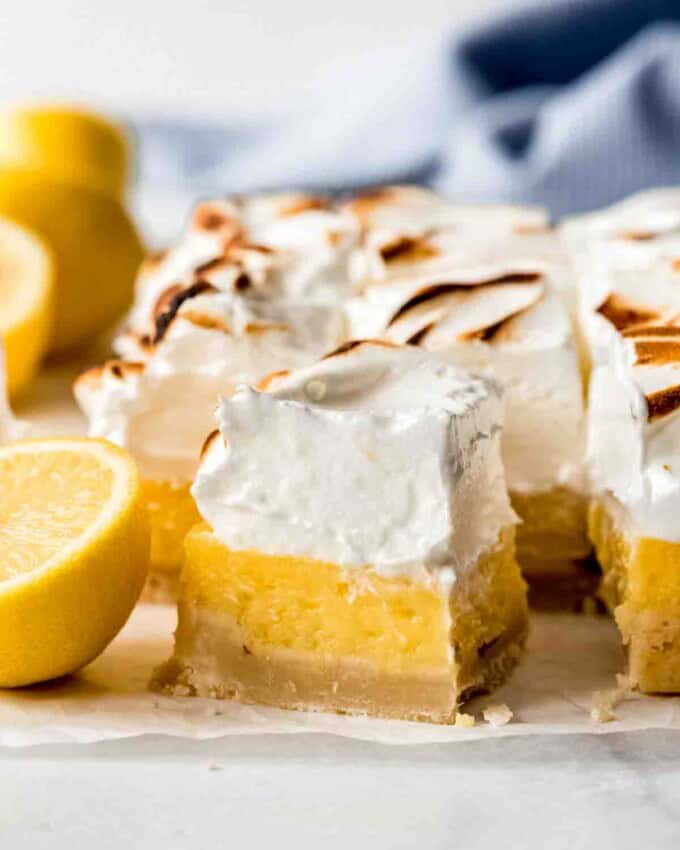 A square lemon bar topped with meringue.