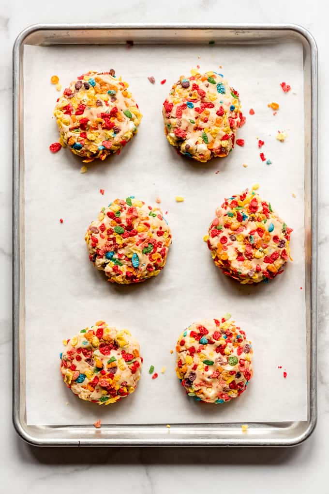 Pucks of Fruity Pebbles cookie dough ready to be baked.