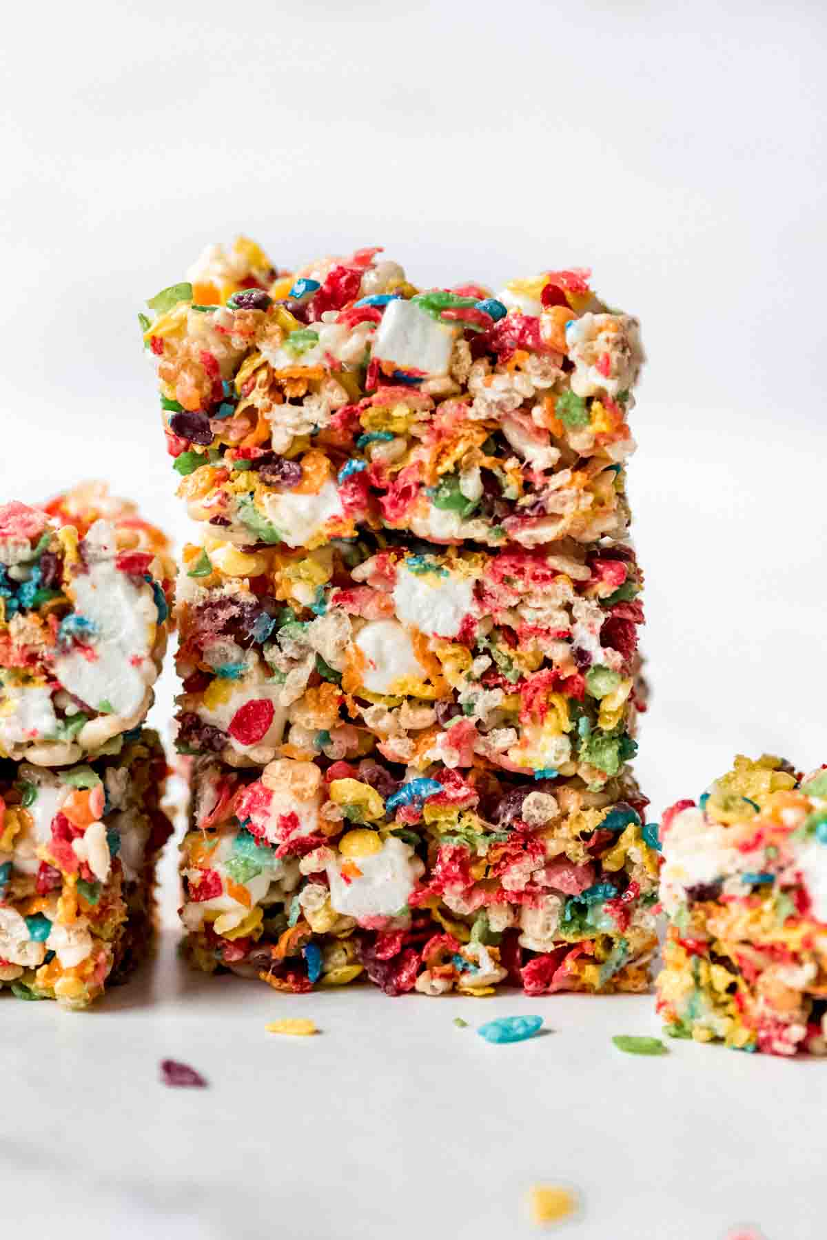 A stack of three rice crispy treats made with fruity pebbles cereal